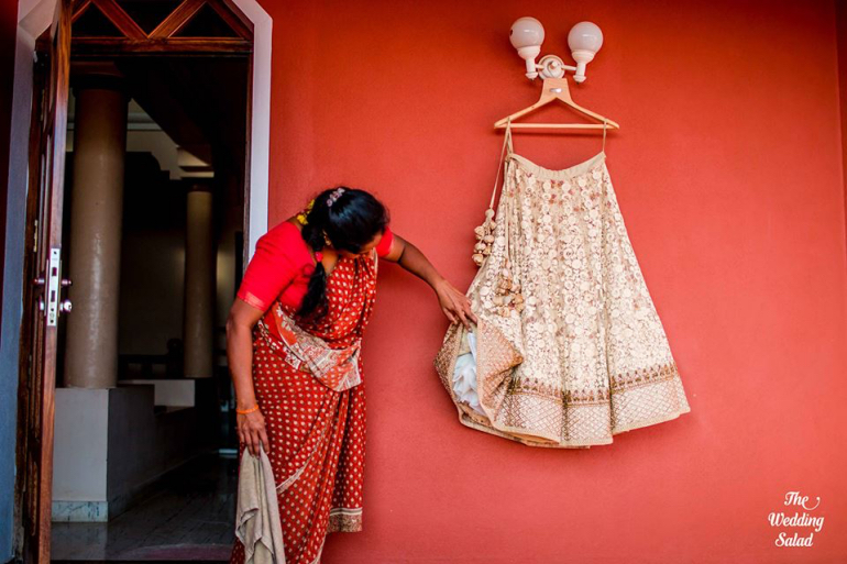 against a bright color wall  with an aunty checking - the wedding salad