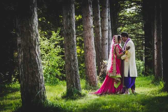 outdoor indian wedding portrait pink bridal lengha