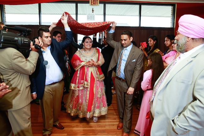 sikh engagement ring ceremony walking down the aisle