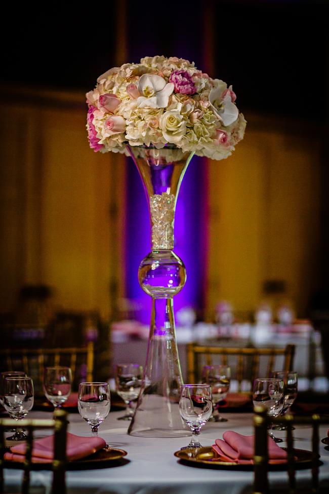 Tall Indian wedding centerpiece with blush pink flowers